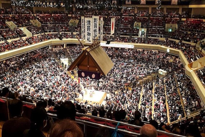 Experience the excitement of sumo wrestling in Tokyo surrounded by passionate fans and the majestic setting of the Grand Sumo Tournament where tradition and sportsmanship unite in a unique cultural celebration.