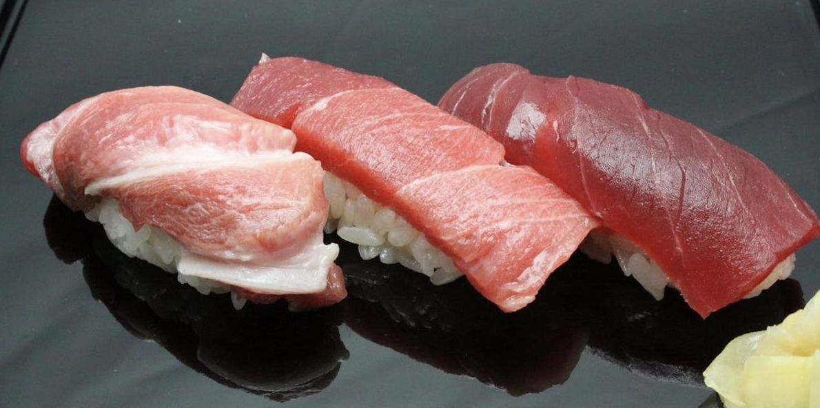 Savor the exquisite flavors of seasonal nigiri crafted with Edo-mae techniques and discover delightful snacks like karasumi at the hinoki counter in Aoyama’s renowned sushi haven.