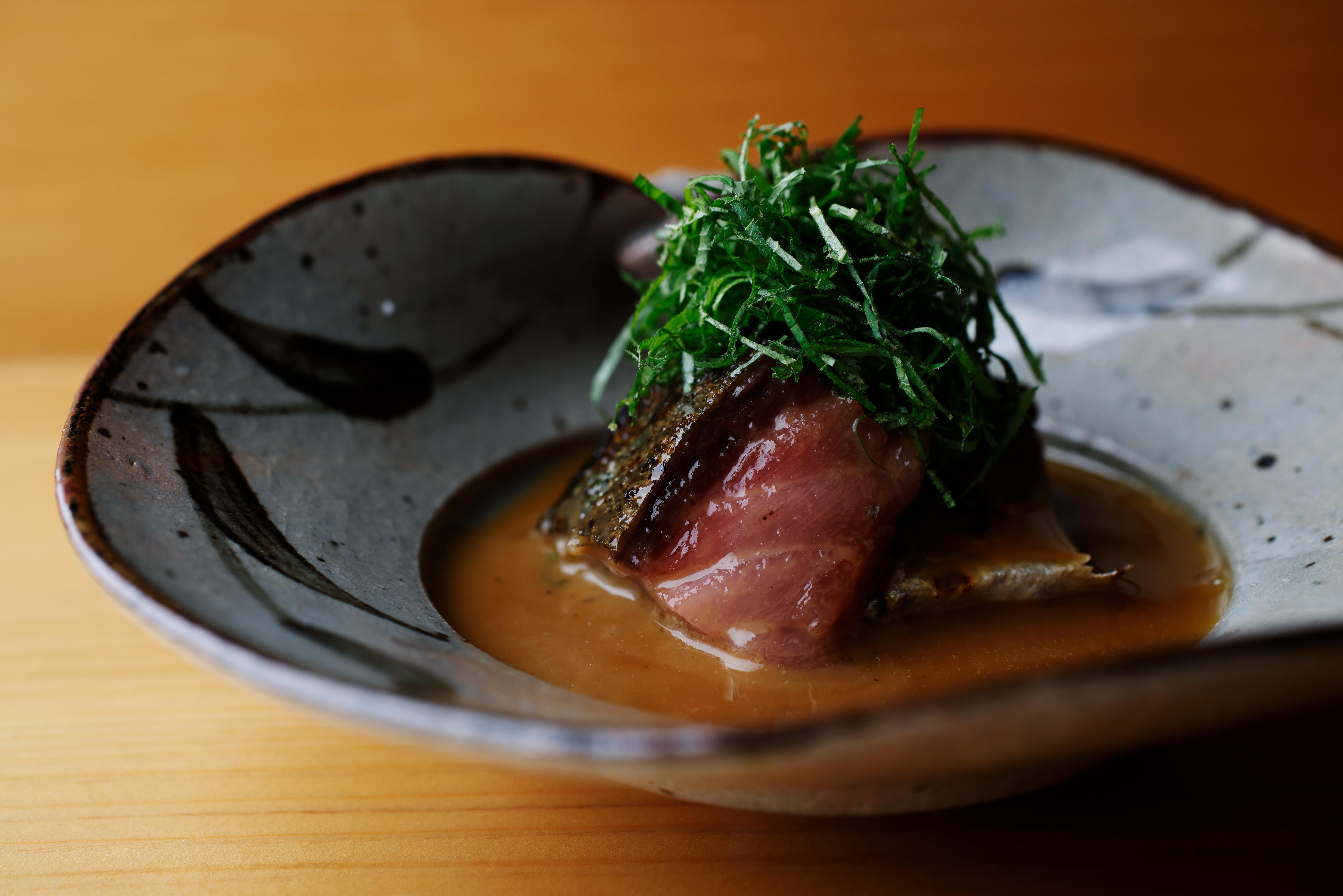 Savor the exquisite sushi artistry at Sushi Tsubomi where each dish reflects the care of a master chef in a cozy setting complemented by a delightful drink.