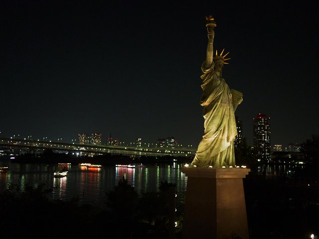 Experience Tokyo's unique blend of iconic sights and modern allure from the illuminated Statue of Liberty replica to shimmering waterfront views creating unforgettable memories in this dynamic city.