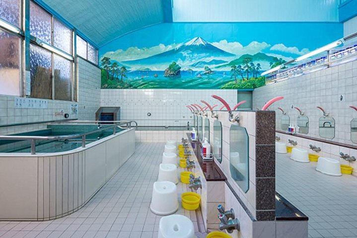 Relax in a unique open-air Onsen experience in the heart of Tokyo featuring scenic views local vibes and complimentary drinks to enhance your soaking adventure.