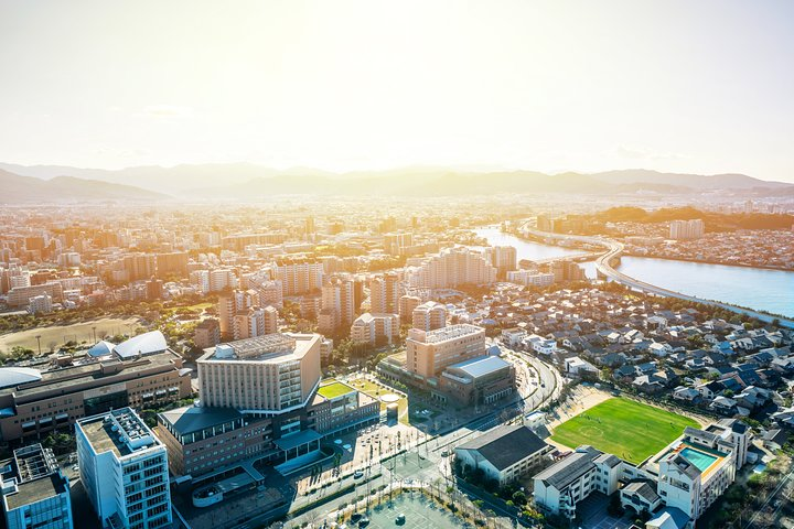 Discover Fukuoka's blend of history and modernity as you stroll along charming streets admiring ancient temples and lively urban centers where each step reveals a story waiting to unfold.