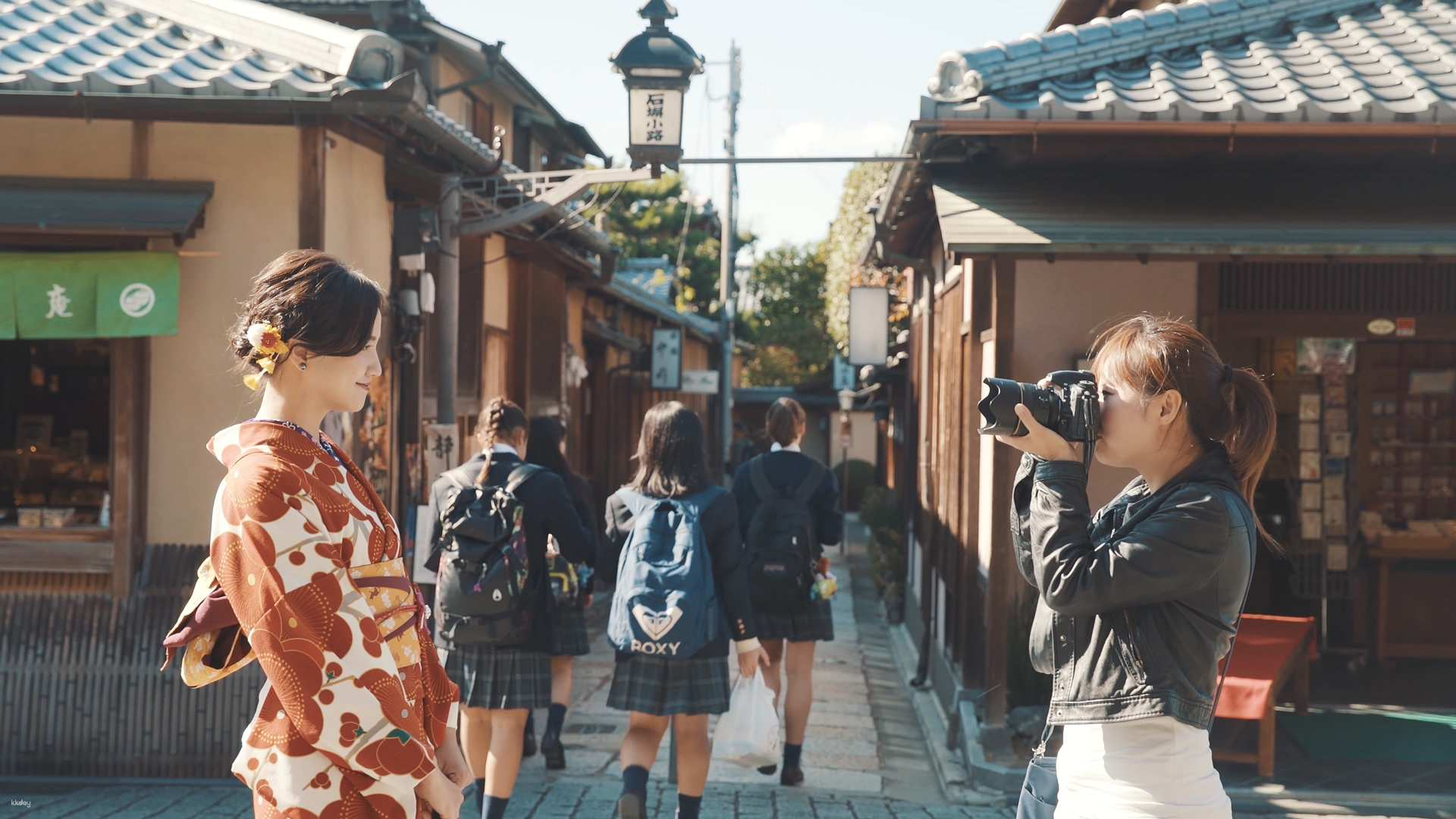 Explore the charming streets of Kyoto in a traditional kimono while a professional photographer captures your joy amidst iconic cultural landmarks creating timeless memories of this historic city.
