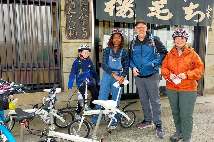 Explore Tokyo’s hidden backstreets on a bicycle discovering charming alleys and historical sites all while enjoying the exquisite beauty of cherry blossoms in full bloom.