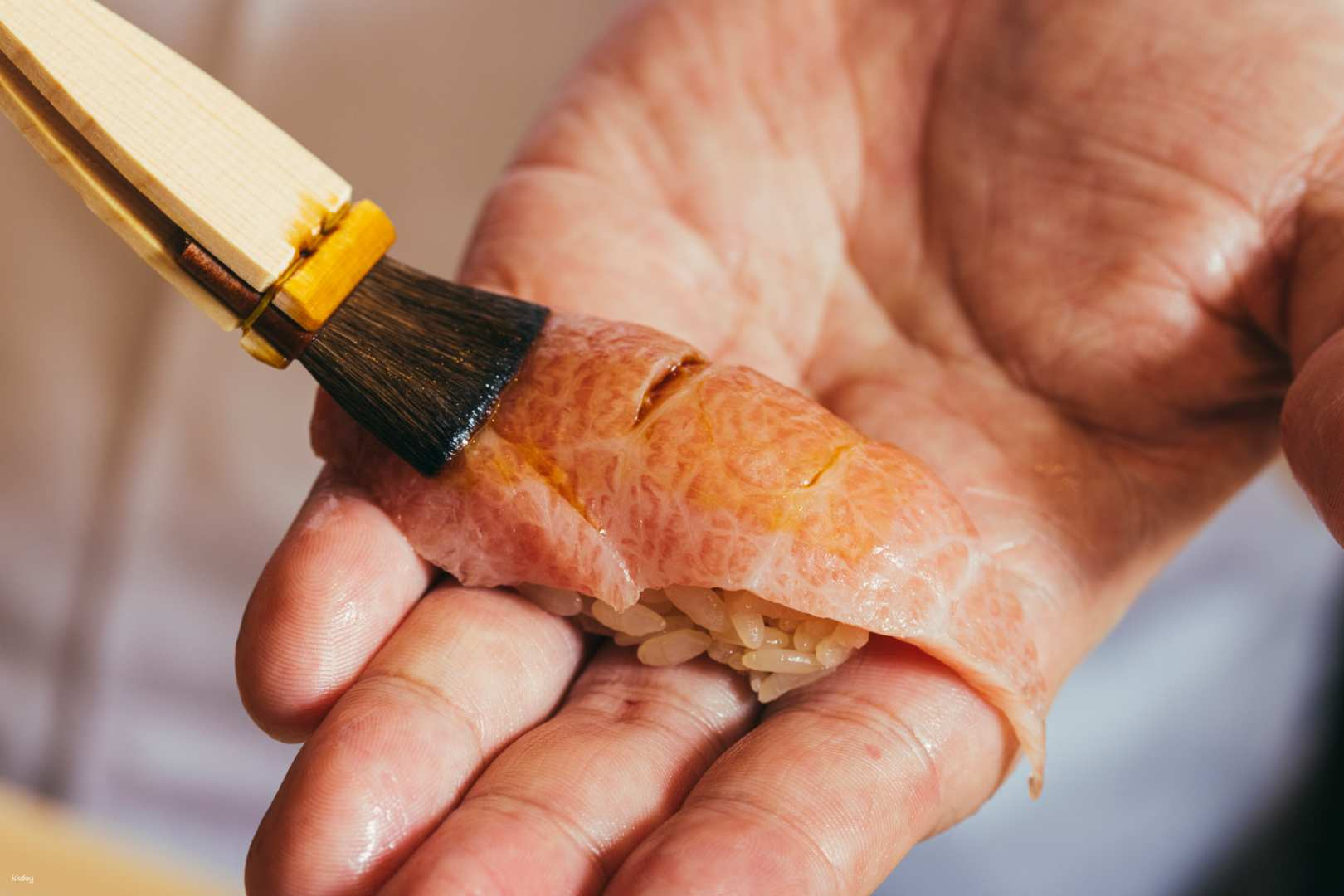 Discover masterful sushi-making as skilled hands bring together exquisite flavors showcasing the art of nigiri creation with fresh high-quality ingredients that redefine Japanese dining.