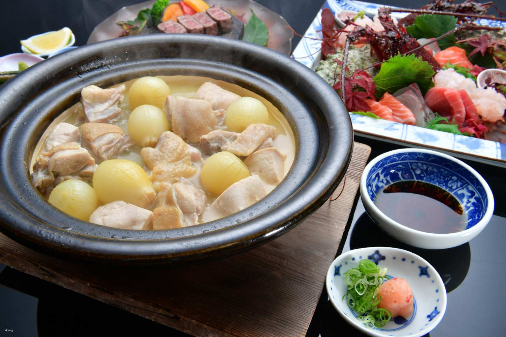 Relish a traditional Mizutaki dinner featuring succulent chicken and seasonal ingredients. The warm pot invites diners to savor Japan's culinary art in a delightful dining experience.