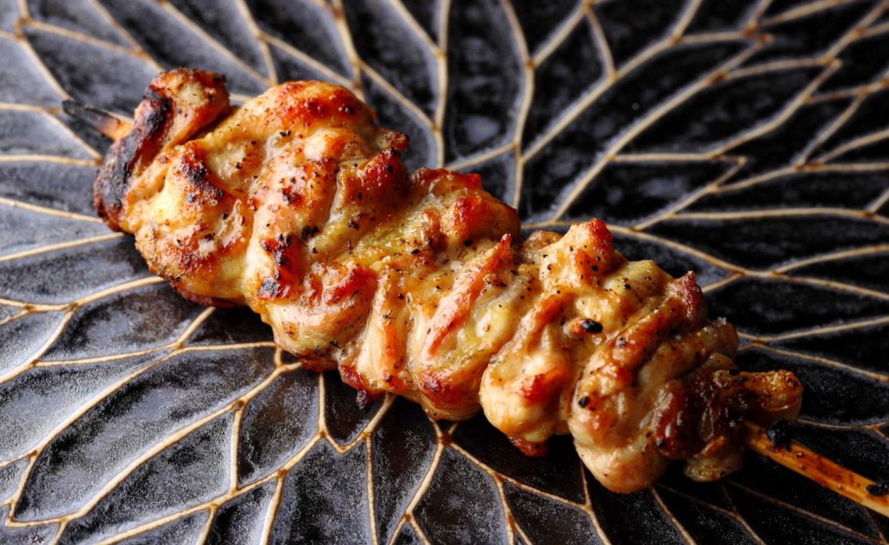 Delight in the exquisite flavors of Yakitori at Tsukiya where each bite showcases the essence of Japanese culinary craftsmanship in an intimate setting with only 16 seats.