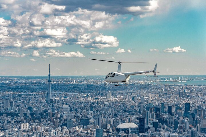 Experience Tokyo's skyline from a new perspective soaring high above iconic landmarks. Enjoy breathtaking views and create unforgettable memories perfect for a special day with loved ones.