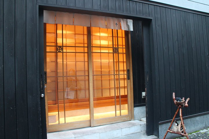 Step through the wooden doors to discover the charm of Kagurazaka where traditional aesthetics meet modern design and explore hidden gems within Tokyo's historic landscape.