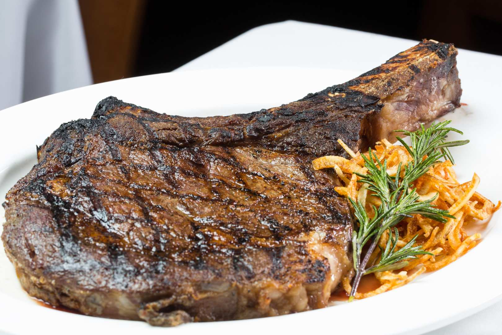 Indulge in the exquisite flavors of USDA Prime Black Angus steak paired with top-notch service in a timeless New York-inspired setting perfect for discerning palates.