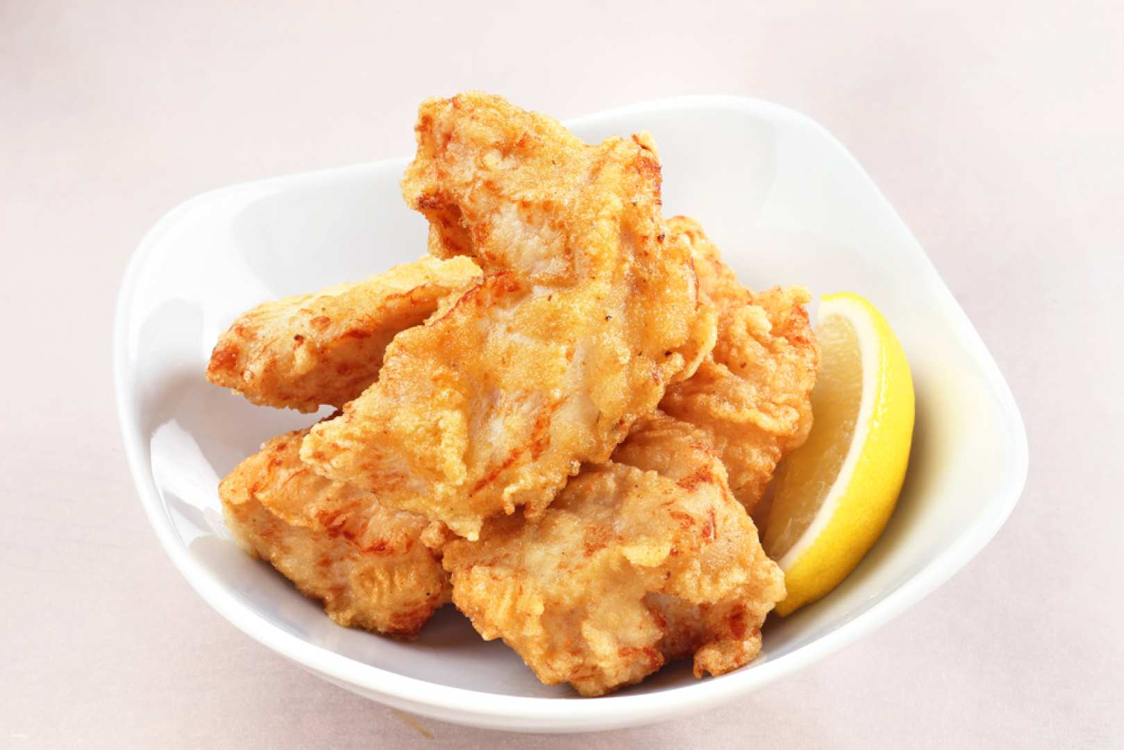 Savor the crispy delight of award-winning fried chicken perfectly golden and tender ready to enhance your culinary journey in the cozy atmosphere of ITADAKI CoccoChan Gotanda.