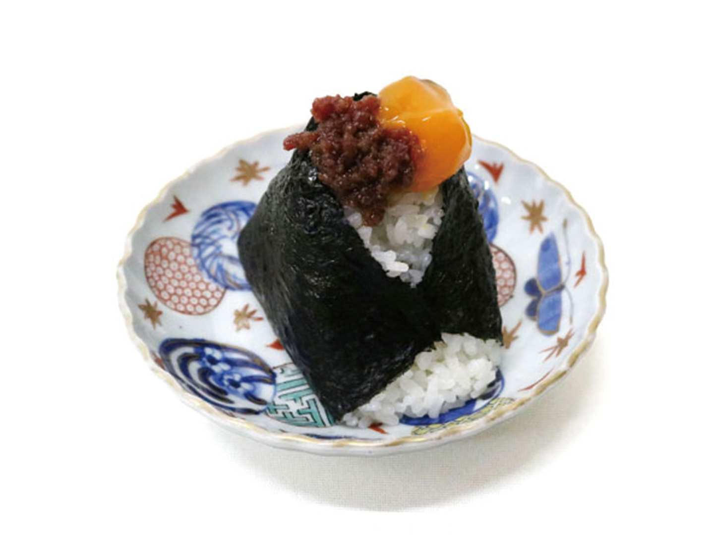 Discover the charm of Shinjuku with onigiri from Onigiri Manma showcasing exquisite rice balls filled with premium ingredients perfect for savoring during your Tokyo adventures.