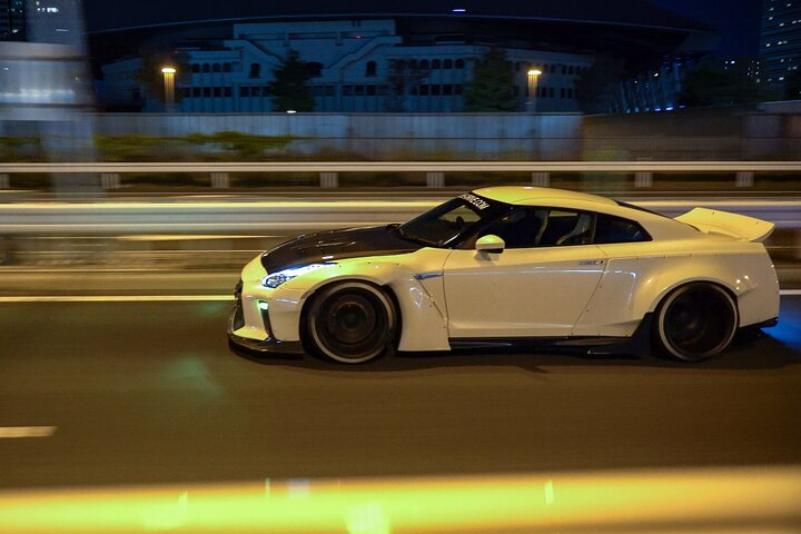 Experience the thrill of zooming through Tokyo's neon-lit streets in a modified R35 GTR connecting with local car enthusiasts and uncovering hidden racing hotspots along the way.