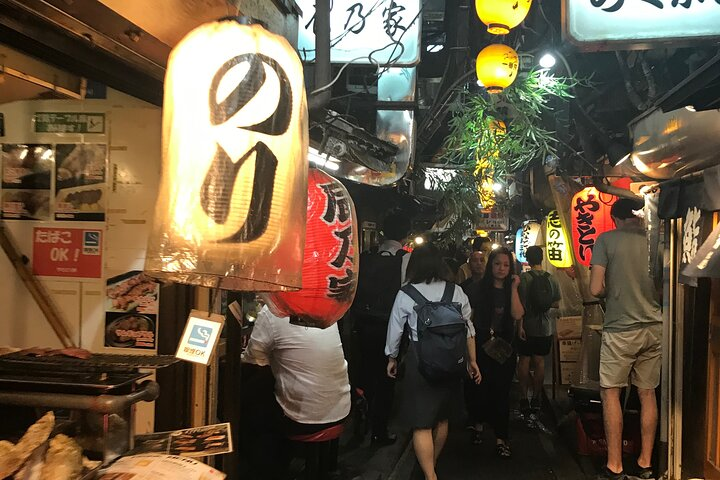 Discover hidden gems as you stroll through lively alleys enjoying local drinks and snacks while engaging with friendly guides and fellow travelers. Immerse yourself in authentic Japanese pub culture.