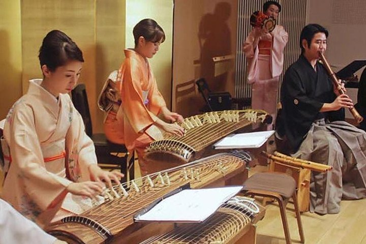 Experience traditional Japanese music as talented musicians engage with each piece and the audience showcasing instruments like the Koto and Taiko in a cozy venue near Tokyo's attractions.