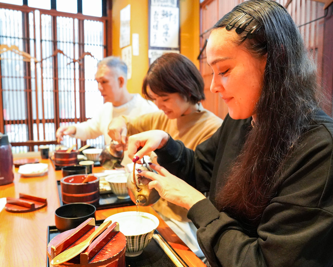 Savor a traditional Japanese breakfast with locals setting the stage for a serene exploration of Shinjuku Gyoen Park's lush gardens and striking contrasts of nature and modernity.