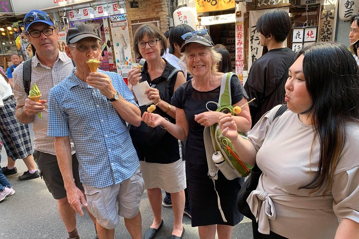 Explore the bustling streets of Ueno where local delicacies and friendly faces come together. Savor unique treats as you delve into Tokyo's rich cultural tapestry and vibrant market life.