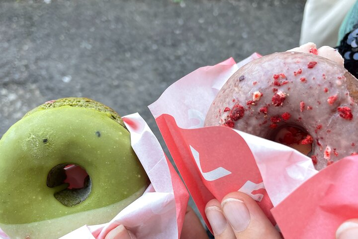 Delight in plant-based donuts as you stroll through Tokyo sampling unique flavors and discovering the city's culinary treasures while mingling with fellow food enthusiasts.