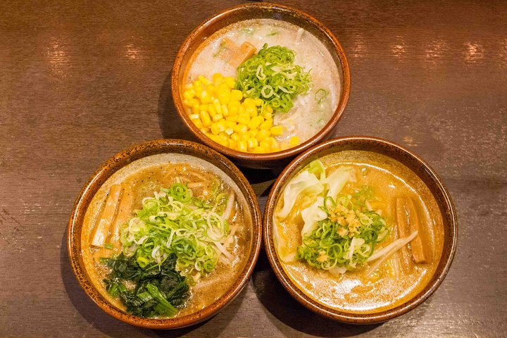 Savor the unique flavors of Hokkaido with mini bowls of vegan and vegetarian ramen showcasing miso shoyu and shio. Experience the rich history of this beloved dish in Shibuya.