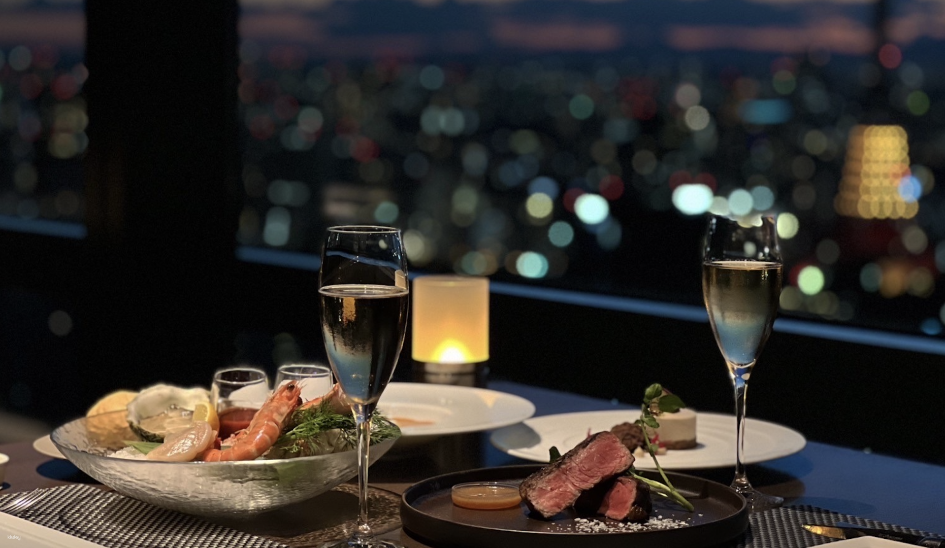 Elevate your dining experience with stunning Tokyo skyline views while savoring exquisite Wagyu steak perfectly paired with a selection of fine wines for an unforgettable evening.