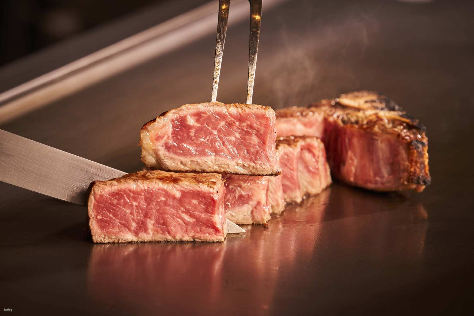 Savor the artistry of master chefs as they prepare exquisite dry-aged beef and Akagyu right before your eyes making each bite an unforgettable experience in Tokyo's dining scene.