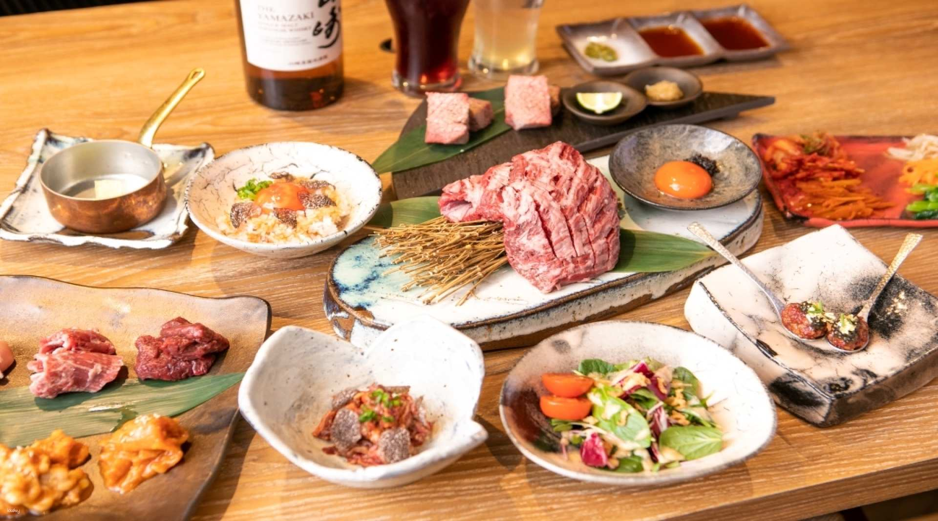 Indulge in the rich flavors of wagyu black beef highlighted by the exquisite Harami skirt steak all served in a cozy wooden setting just minutes from Namba Station.