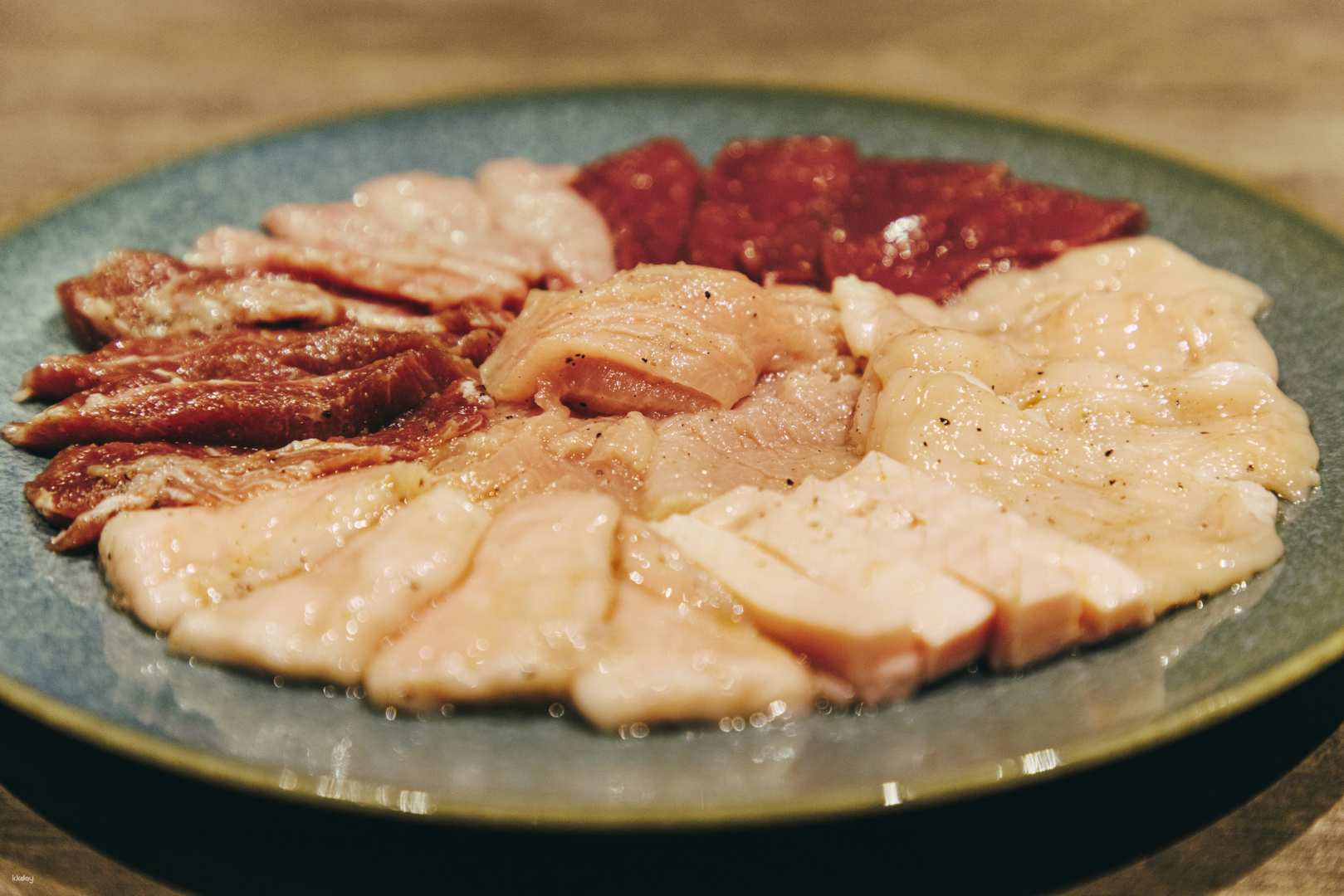 Experience the art of yakiniku at Ushigoro Ginza where expertly prepared cuts of beef and offal invite you to share delightful moments with friends and family over a delicious meal.