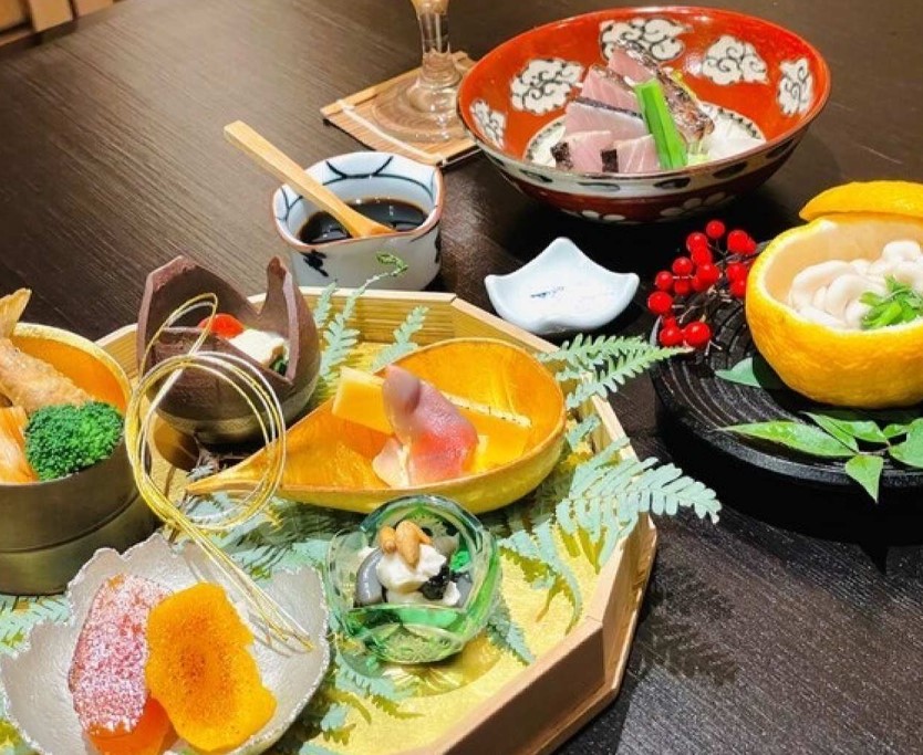 Savor seasonal delicacies presented artistically where each dish tells a story of traditional Kyoto kaiseki inviting a unique culinary journey in the heart of Tokyo.