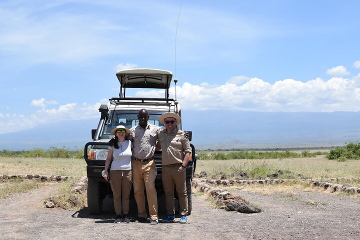 Our Client posing for a Photo during their Full day Safari in Amboseli N/P.
