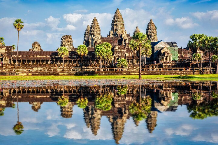 Explore the stunning architecture of Angkor Archaeological Park where ancient temples stand proud against serene waters inviting travelers to immerse in rich history and breathtaking landscapes.