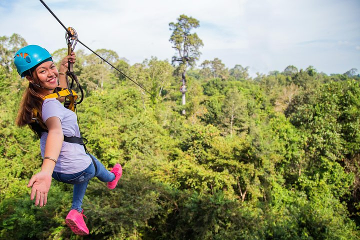 Soar above the lush canopy of Angkor Archaeological Park exploring ancient ruins while zipping between trees and enjoying the breathtaking scenery. Adventure awaits in Cambodia's stunning landscape.