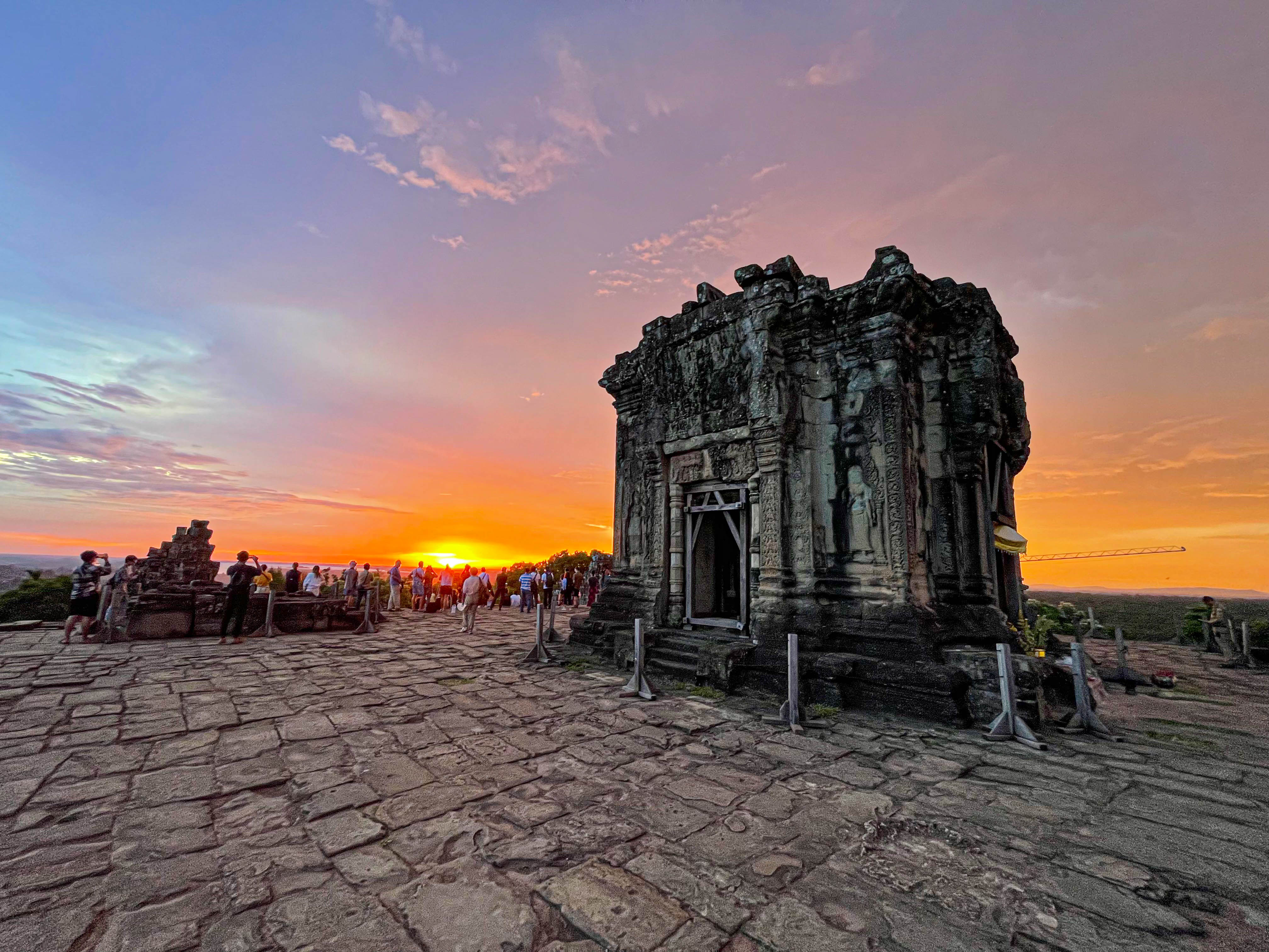 Experience the breathtaking views from Phnom Bakheng as the sun sets over the ancient ruins creating an unforgettable backdrop that beautifully complements the rich history of Angkor Wat.