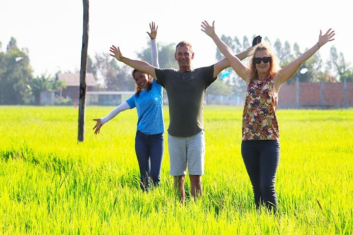 Experience the serene beauty of Chreav Village where lush rice fields meet joyful exploration creating perfect moments for unforgettable photography amidst the rich tapestry of Cambodian rural life.