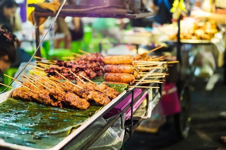 Discover the lively street food scene of Phnom Penh sampling delectable grilled skewers and local specialties that define the culinary heart of the city during this immersive food tour.