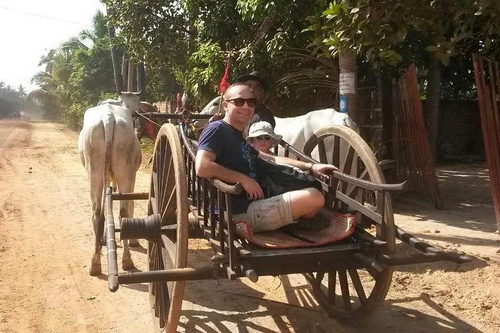 Angkor Cab customers riding an oxcart ride 