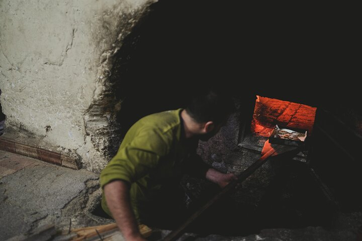 A tray of sardines ready to cook in the wood-fired oven of an old bakehouse