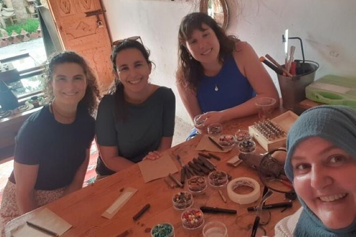 Making earrings and necklace pendants with metal, wire and beads.