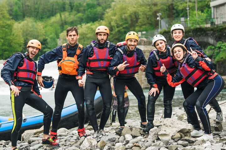 Rafting team having fun after swimming in the waterfalls and jumping off cliffs