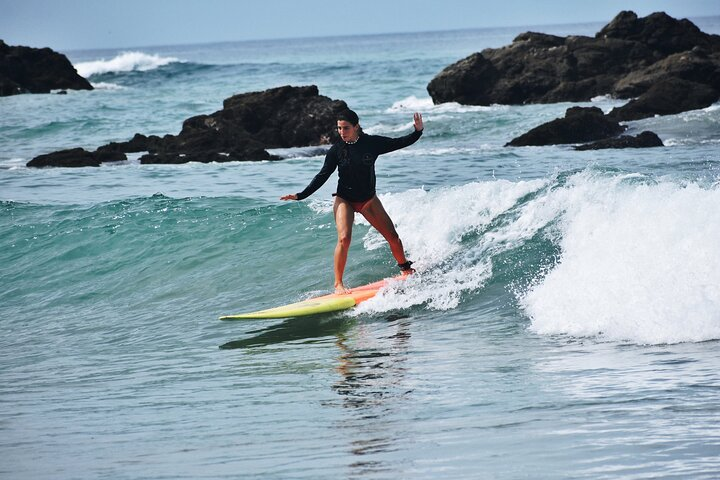 Our student surfing a fun wave
