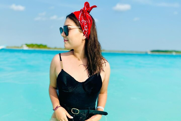 Pose for a photo in the waters of Bacalar
