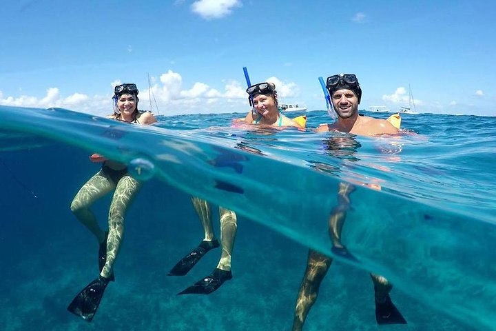 Snorkeling underwater with your friends.