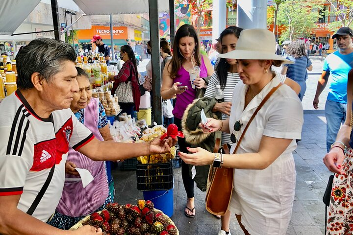 Buying some fresh pitayas (cactus fruit)