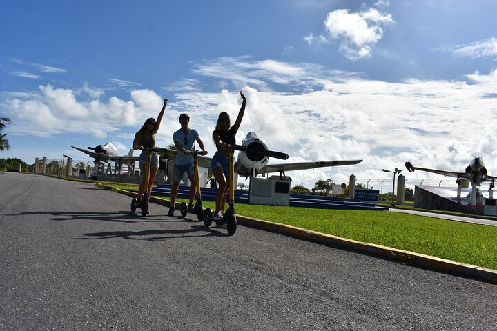 Guided Day Tour in Cozumel on a Clear Boat and Electric Scooter - Photo 1 of 6