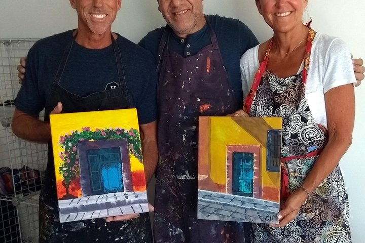 Proud participants with their paintings 