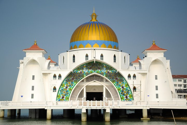 Discover stunning architectural beauty at the iconic Malacca Straits Mosque where every angle offers a perfect backdrop for memorable photos during your journey through Melaka's rich cultural landscape.