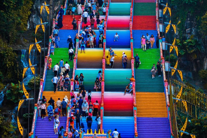 Experience the lively energy of the Batu Caves' colorful stairs where every step reveals the joy of exploration and the beauty of Malaysia's rich culture. Perfect for memorable moments in your journey.