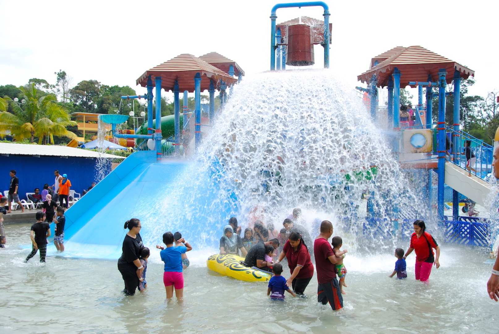 Experience endless fun at Melaka Wonderland Water Theme Park where families splash around in water slides and explore unique attractions against a backdrop of stunning natural scenery.