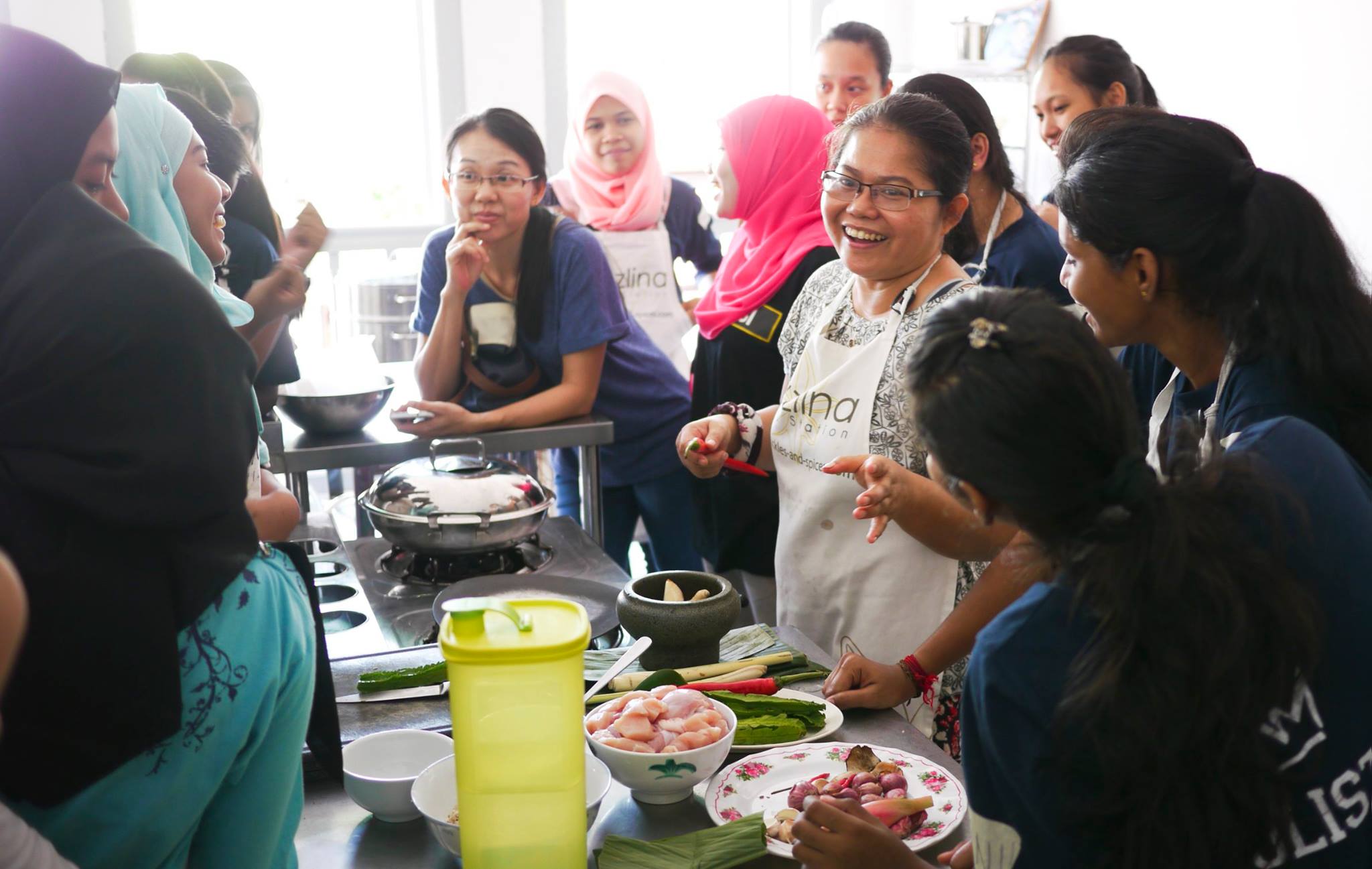 Experience the joy of gathering with fellow food lovers sharing laughter and learning the secrets of Penang cuisine under Nazlina's expert guidance in a charming historic shophouse.