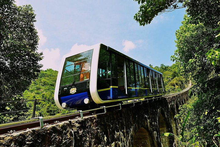 Experience a delightful ascent on the funicular train offering breathtaking views of Penang Hill and lush surroundings perfectly complementing your exploration of its historical gems.