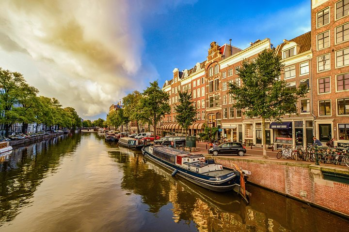 Enjoy Dutch cheese and a boat trip in the famous canals of beautiful Amsterdam city centre.